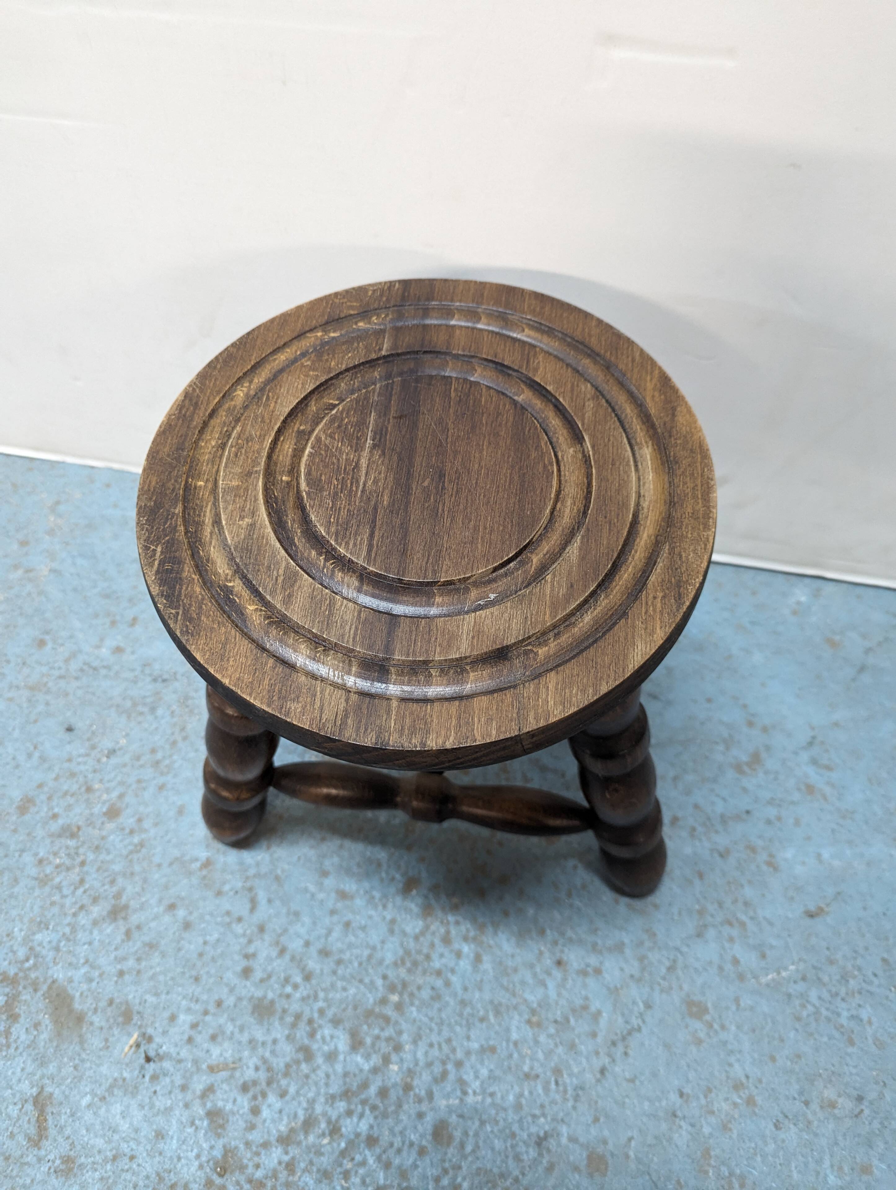Rustic three-legged oak stool
