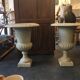 Pair of medicid vasques, cast, exterior