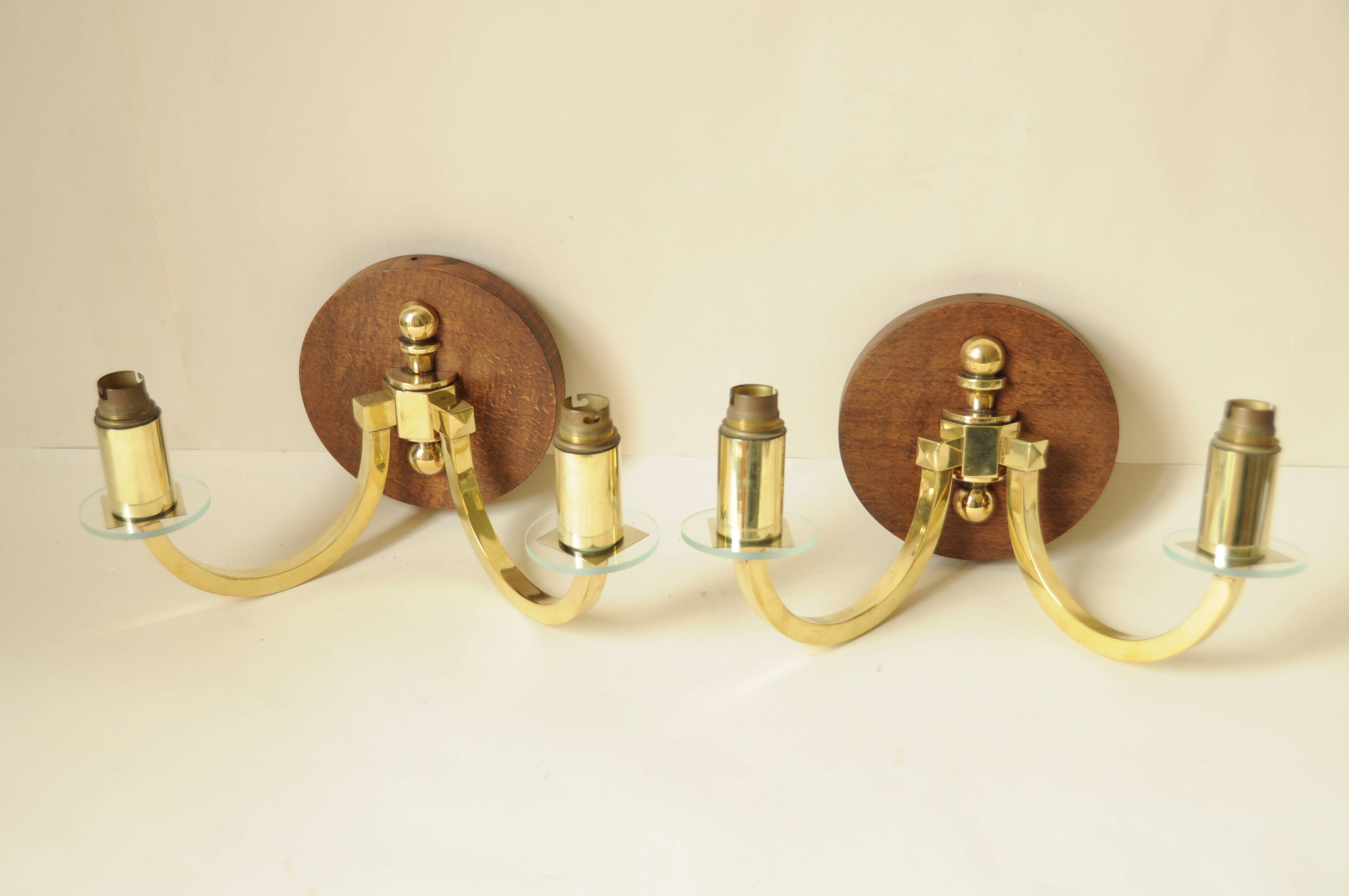 Pair of vintage wall sconces in polished gold brass, wood and glass