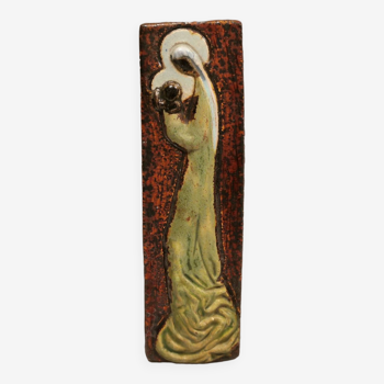 Slim relief with a motif of Madonna and child.