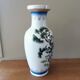 Vintage ceramic vase with Asian decor.