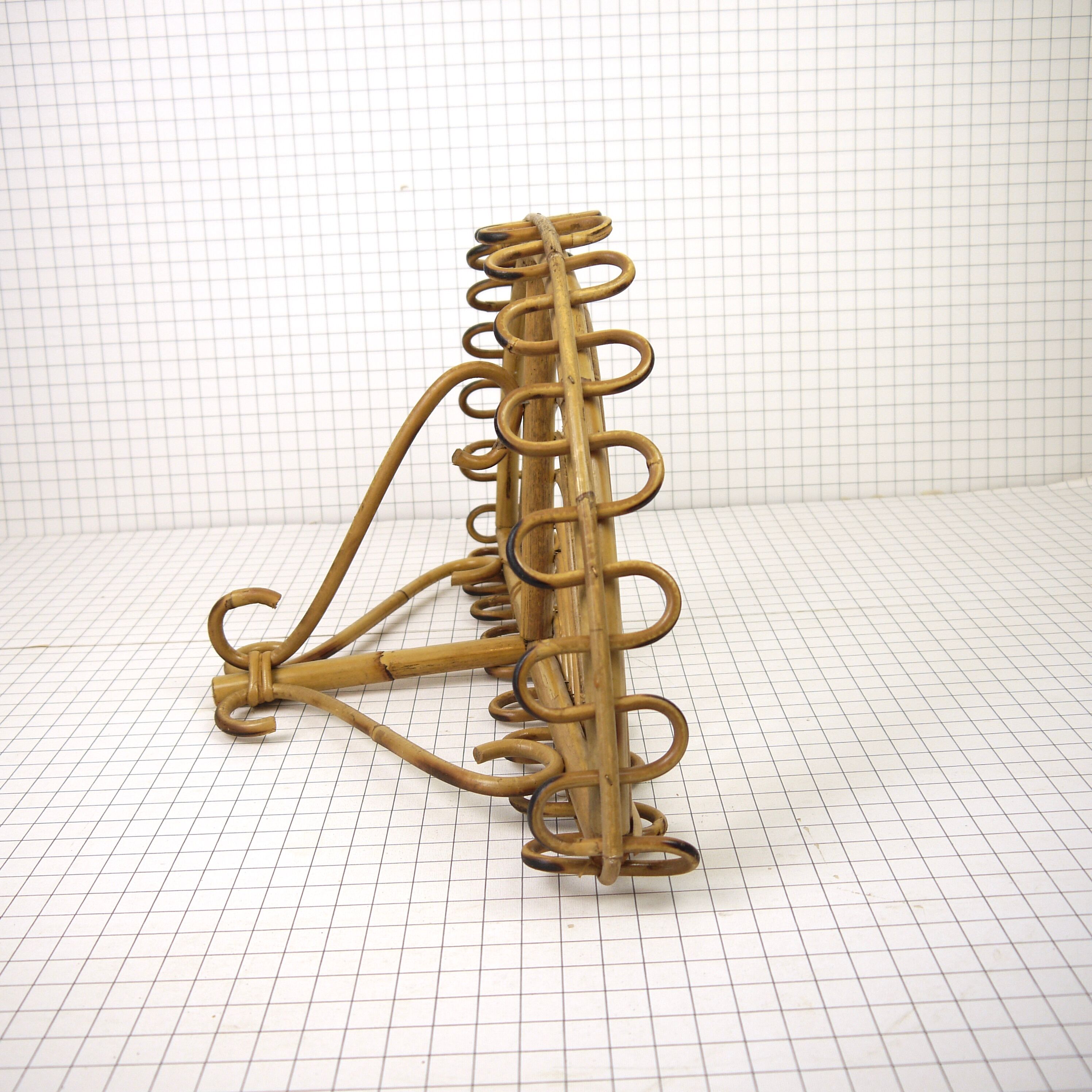 Half-moon rattan shelf and coat holder