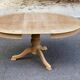 Extendable round dining table with central leg, renovated in raw wood, 20th century