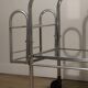 Vintage 1970s rolling dessert trolley in chrome metal and mirrored glass.