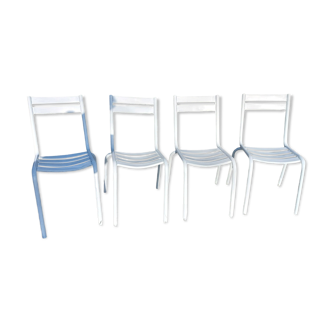 4 white metal chairs