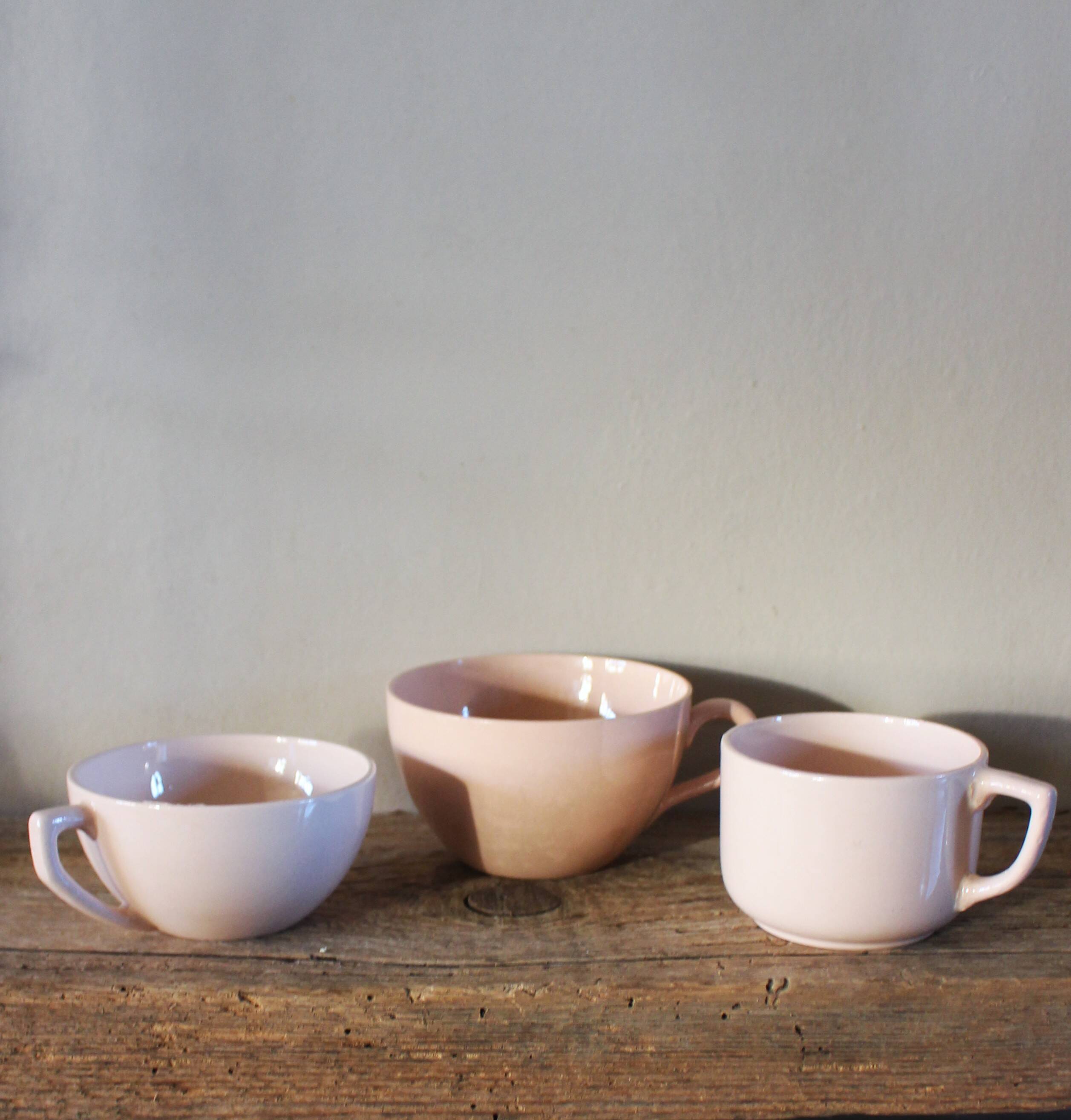 A set of 3 pink earthenware cups from Digoin Sarreguemines.