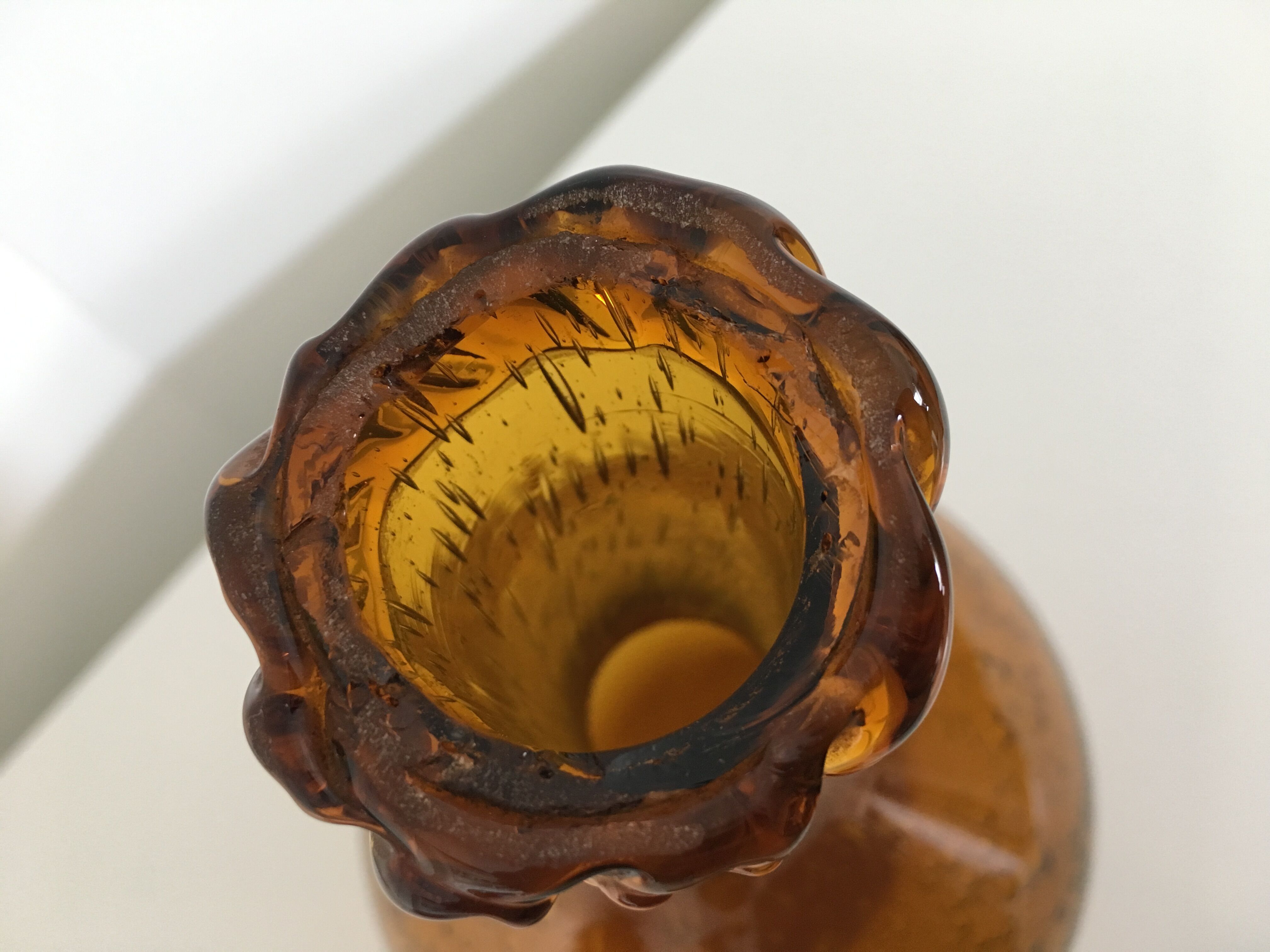 Biot blown glass amber bottle