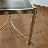 Table basse en laiton et verre fumé
