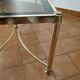 Table basse en laiton et verre fumé