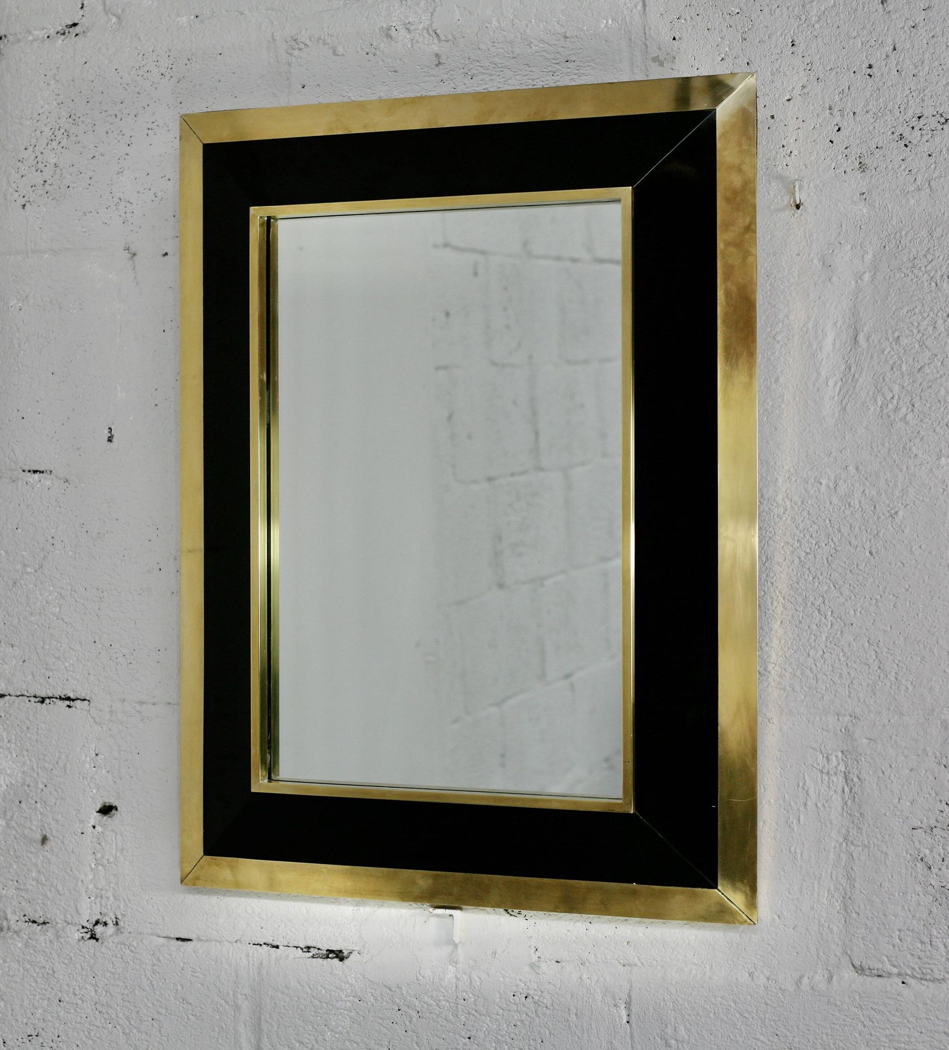 Jean-Claude Mahey mirror. Black lacquered wood and gold metal. 1970