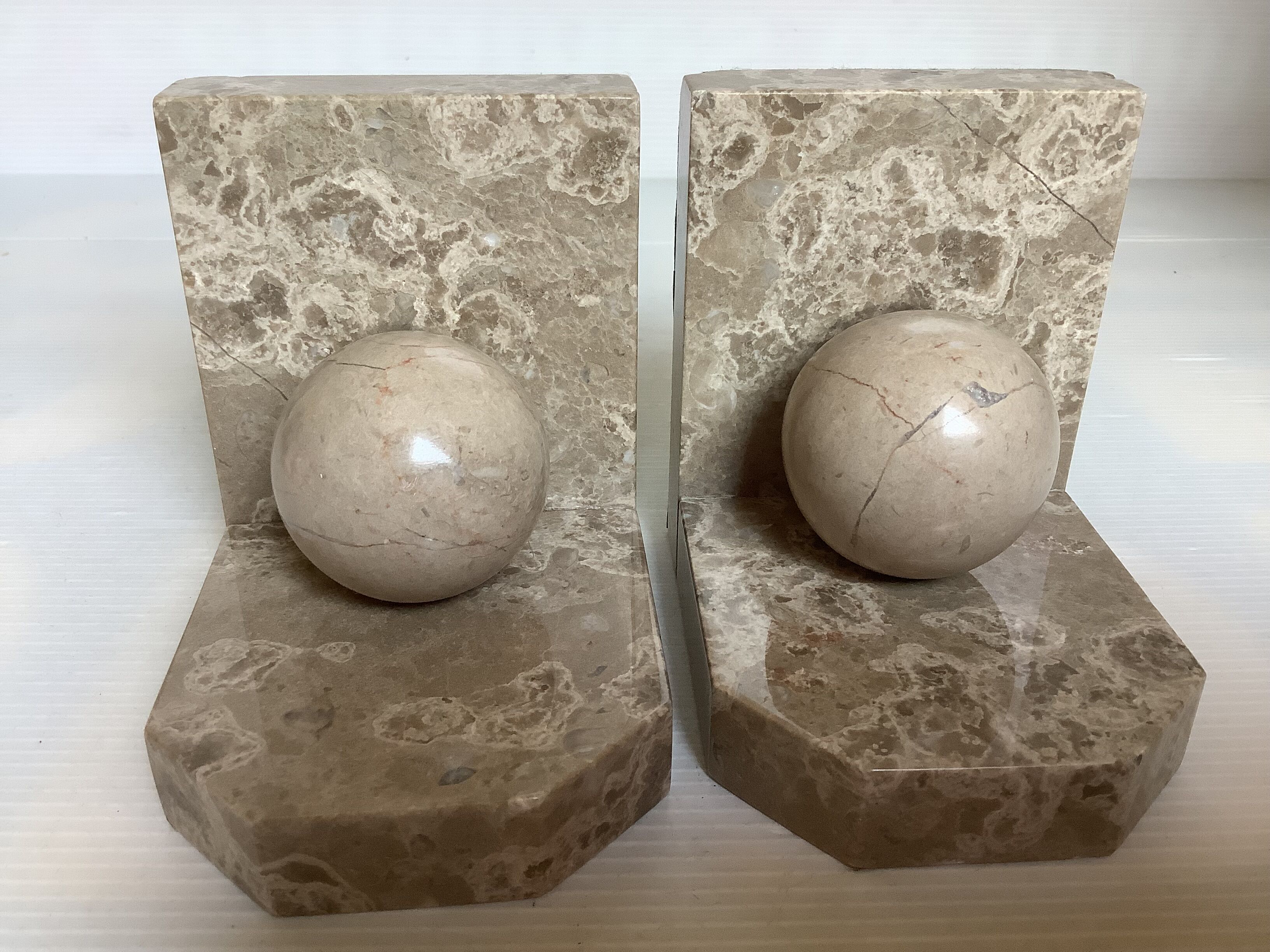 Pair of beige marble bookends.