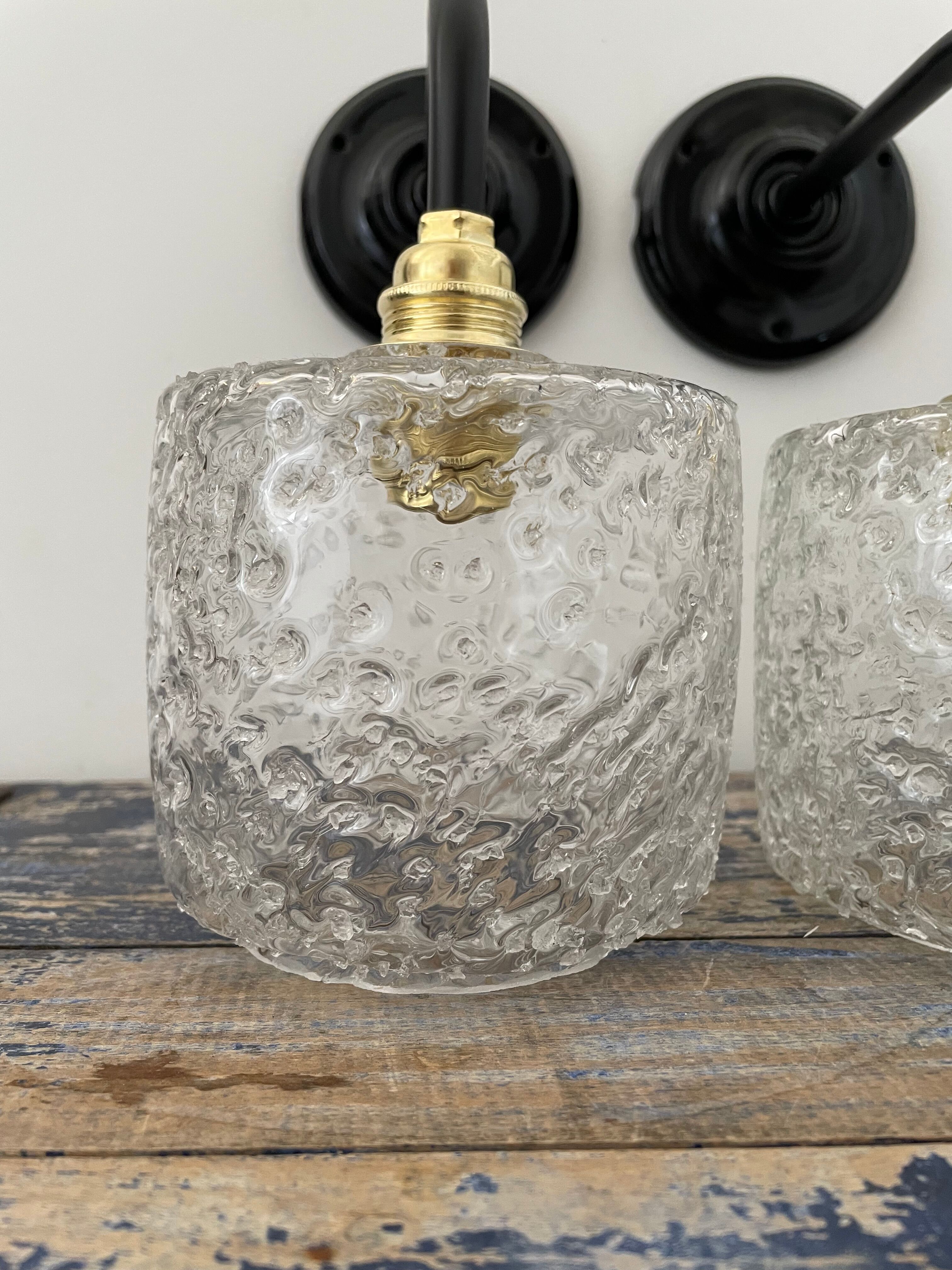 Set of two chiseled glass sconces
