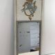 Louis XVI style mirror in patinated carved wood