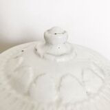 Vintage covered pot in white earthenware molded with lions and friezes