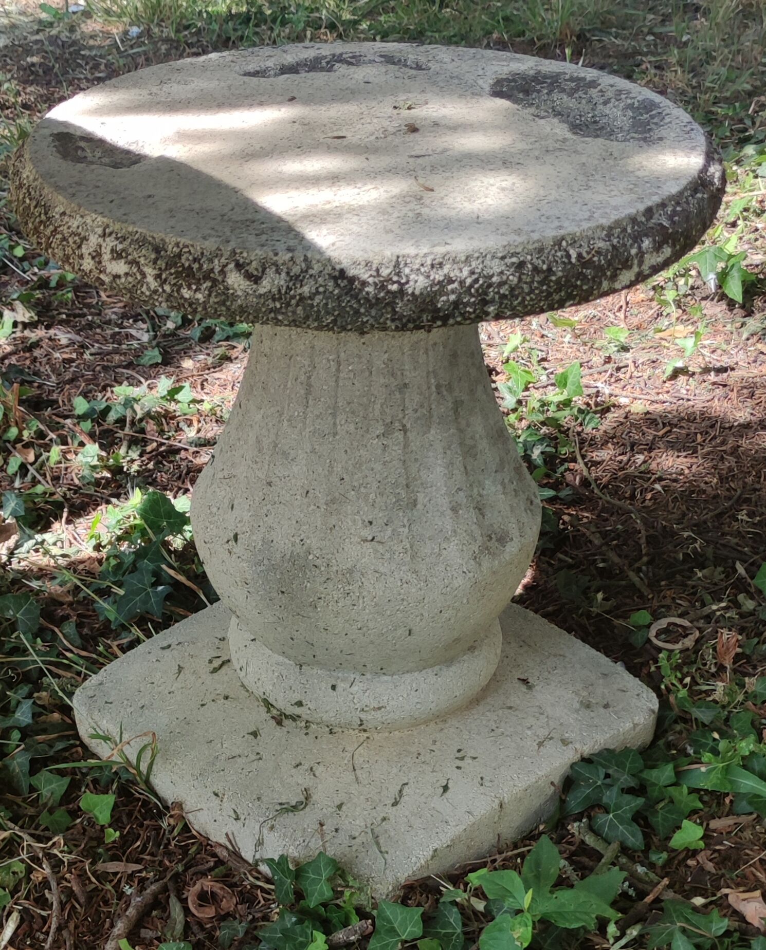 Old garden furniture in reconstituted stone