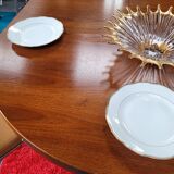 Baumann style round table with integrated extensions from the 70s