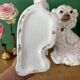 Pair of Staffordshire-type dogs in white and gold ceramic