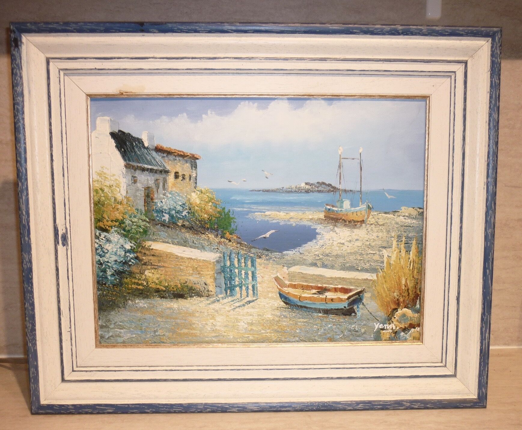 Oil on canvas of a boat on the foreshore signed Yann 55X45