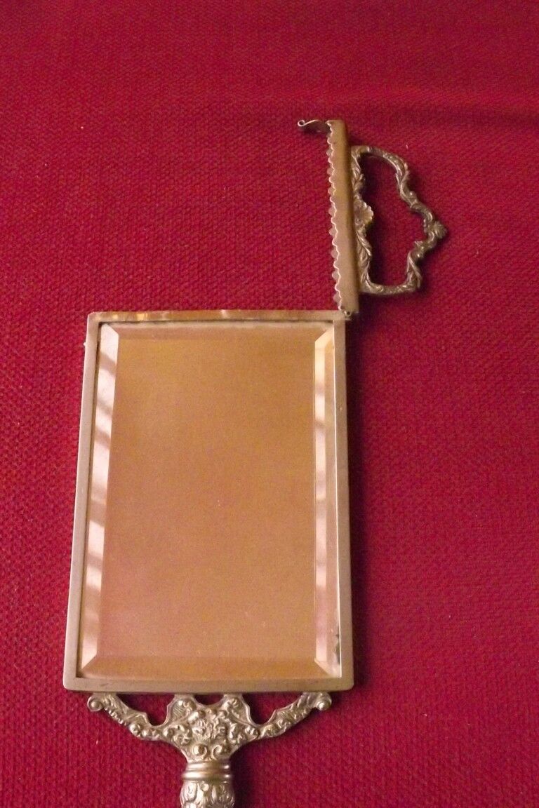 Mirror opposite hand 1900 silver metal