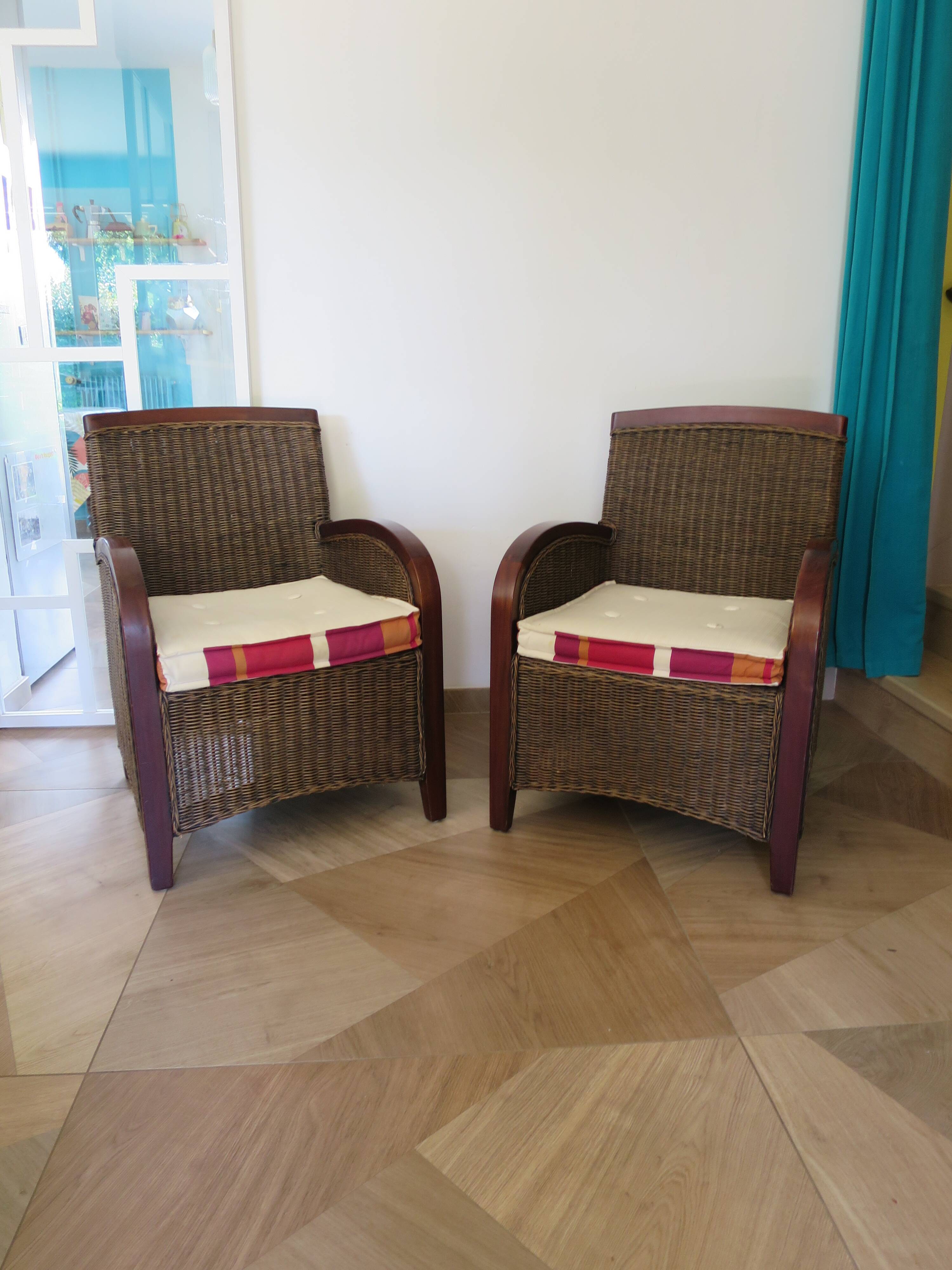 2 armchairs in woven rattan and wood, 1980s