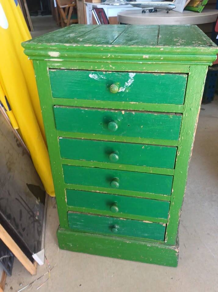 Vintage workshop furniture with 6 green drawers.