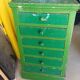 Vintage workshop furniture with 6 green drawers.