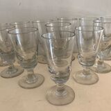12 old glasses on foot at bistro or absinthe