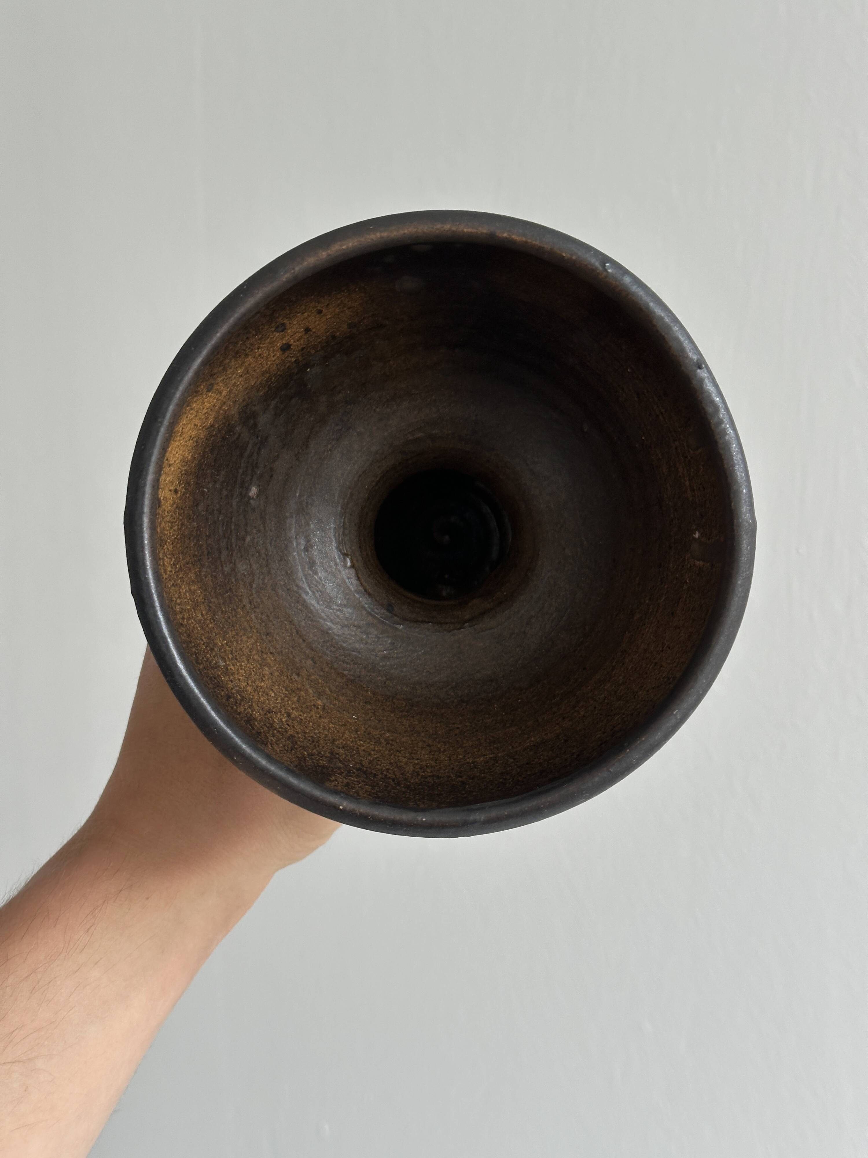 Dark brown raw ceramic cup