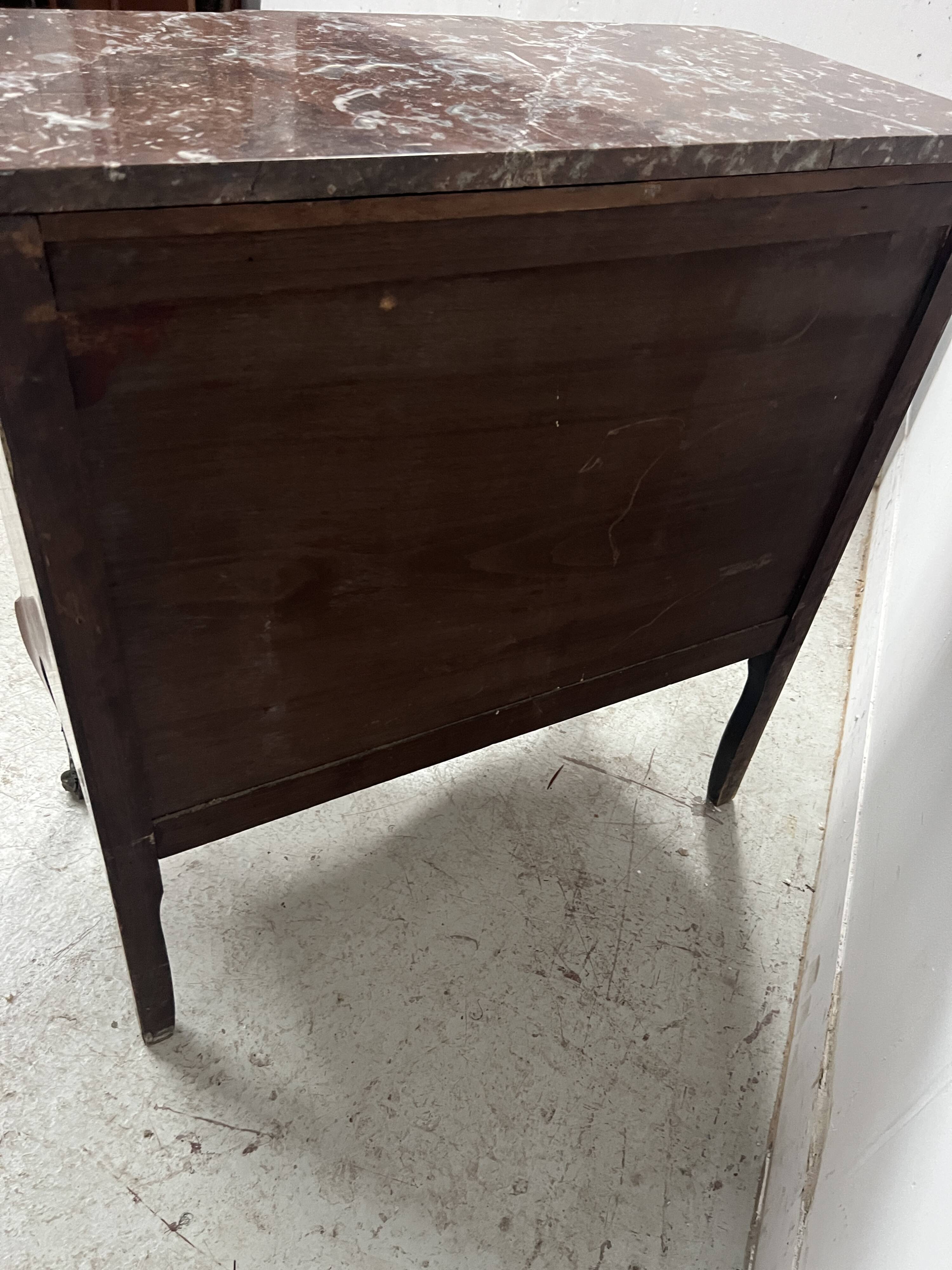 Transitional style commode with a protruding front, in marquetry wood, 20th century.