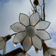 Brass chandelier and flowers in mother-of-pearl petals