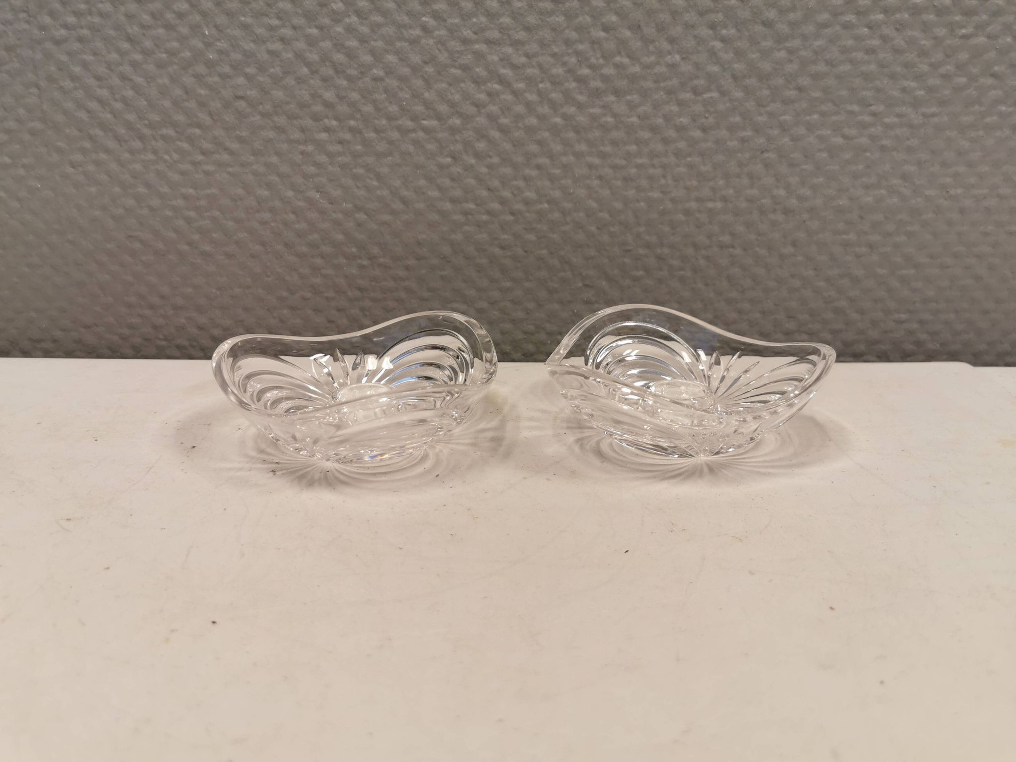 A set of beautiful rock crystal glass candle holders from Swedish Orrefors. Estimated 1970s.