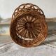 Wicker fruit bowl on a stand
