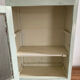 Old medicine cabinet in mint green patinated wood