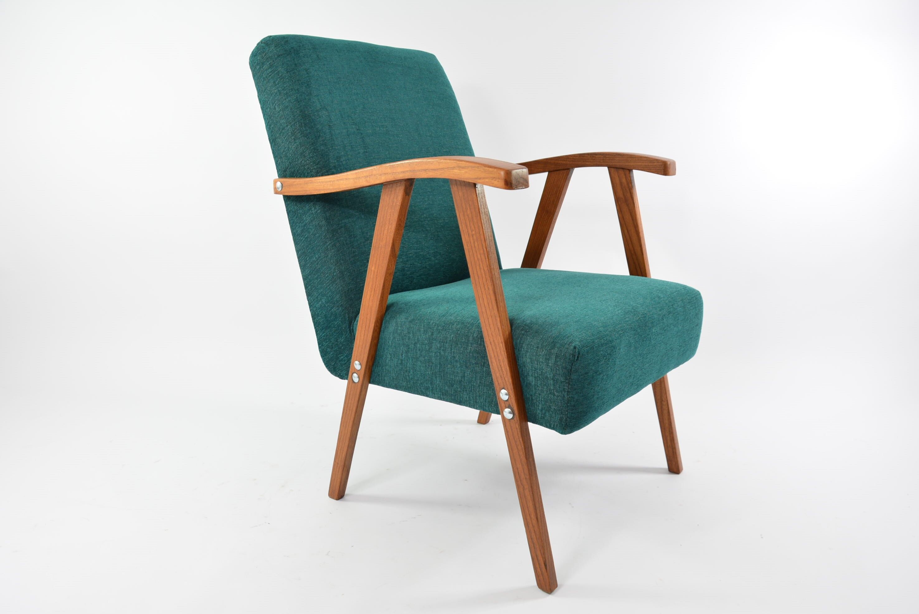 Green curved armchair
