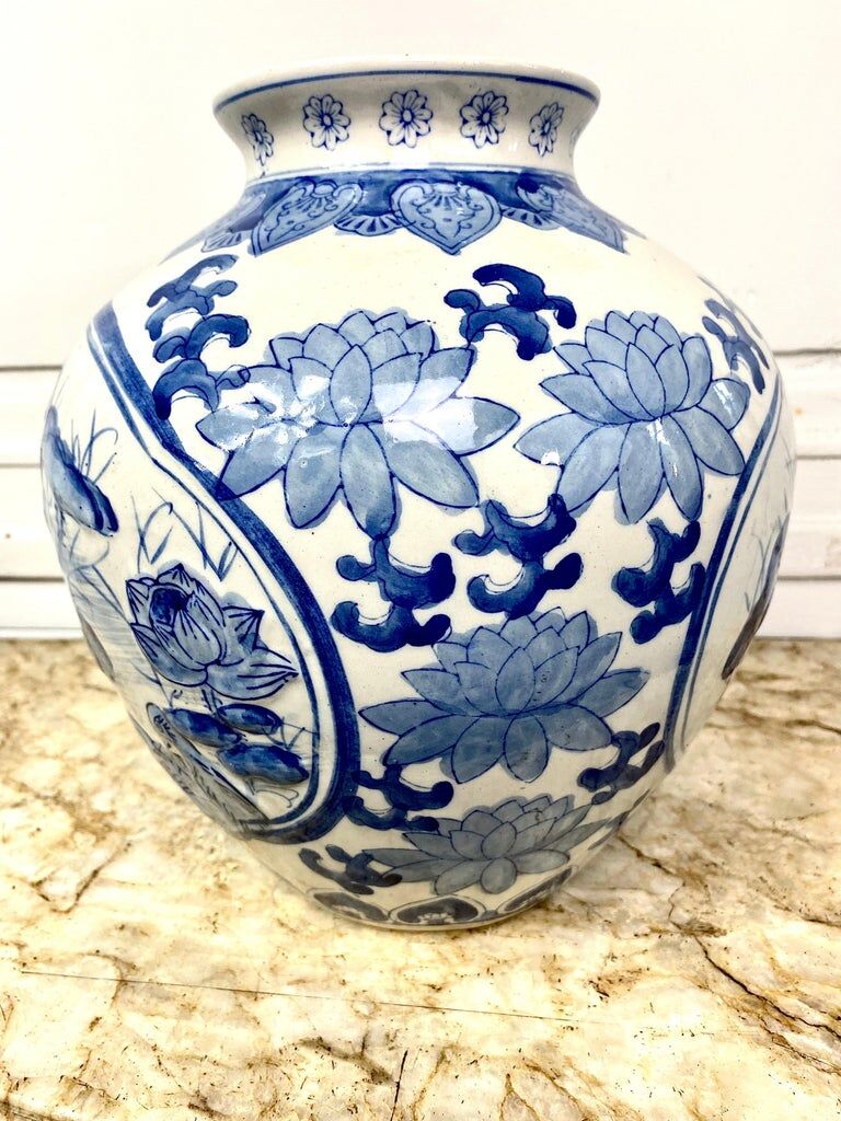 Chinese vase in blue-white porcelain decorated with lotus flowers