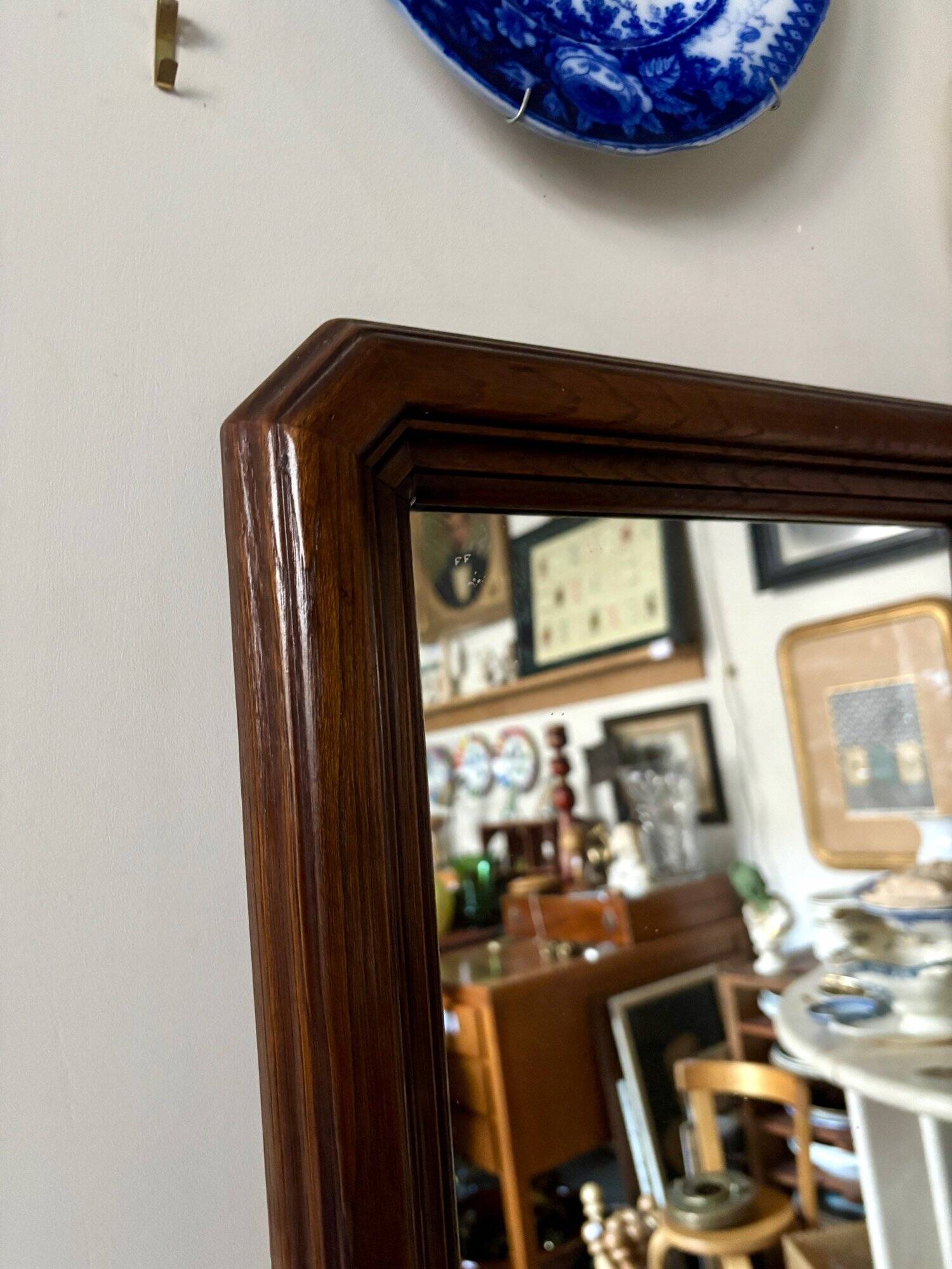 Full-length rectangular mirror in dark wood
