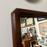 Full-length rectangular mirror in dark wood