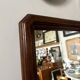 Full-length rectangular mirror in dark wood