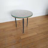 Small side table decorated with cigar rings under beveled glass