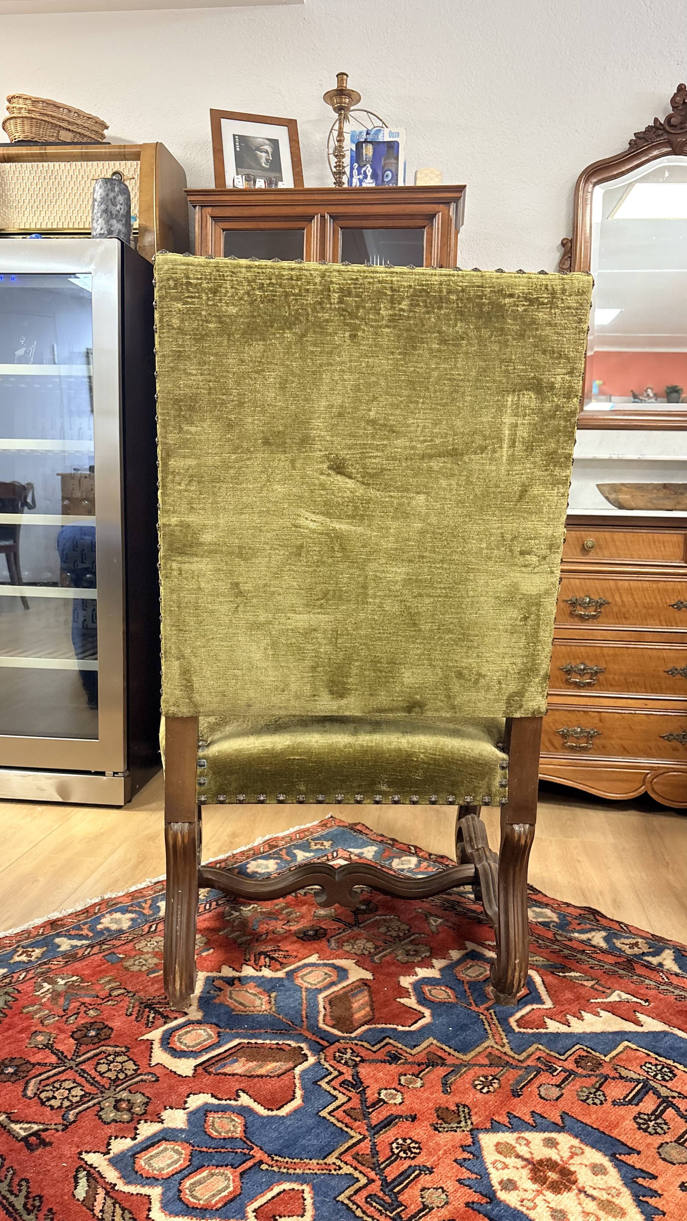 Magnificent armchair in carved solid walnut, in the Henri II style.