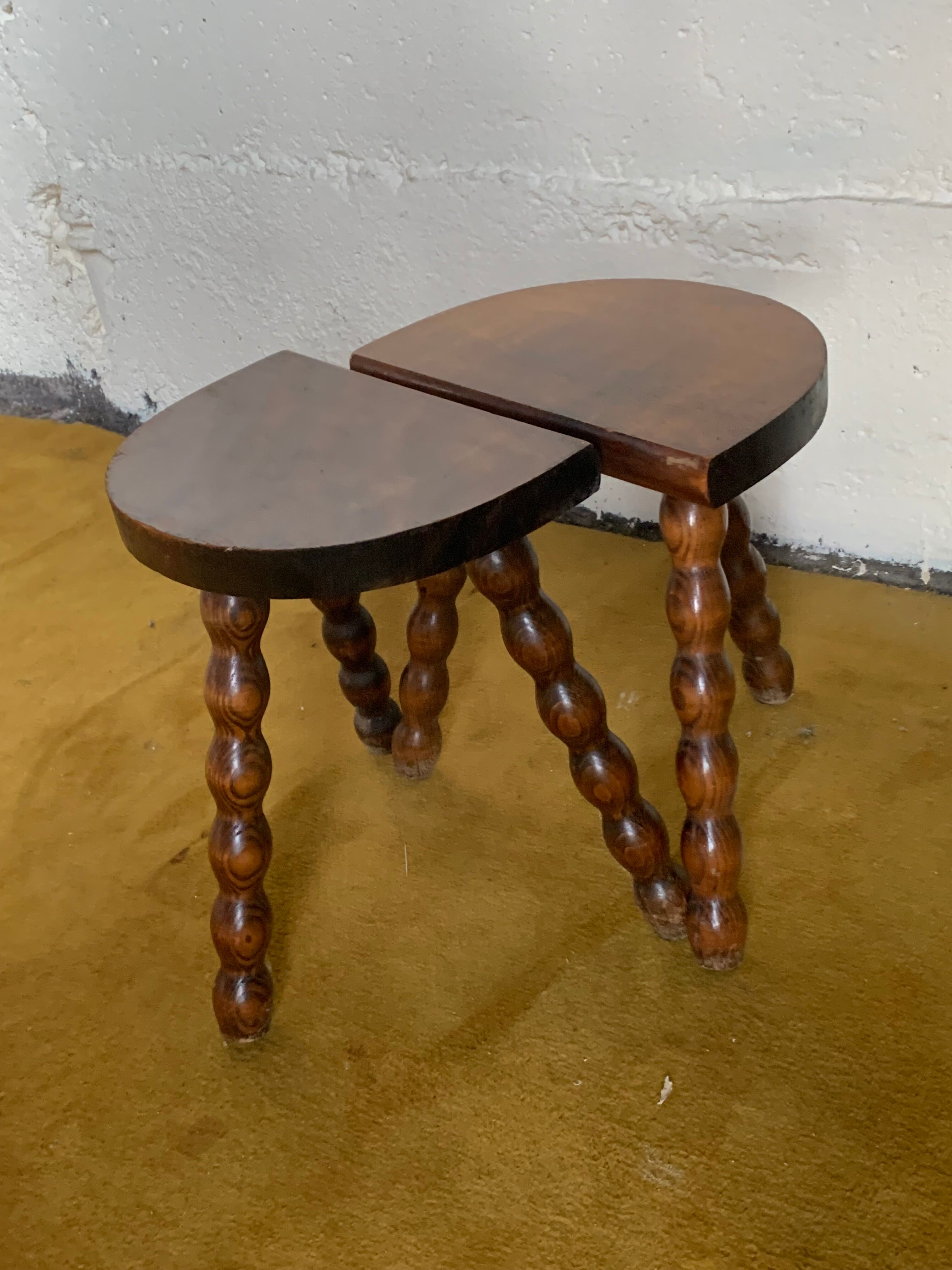 Duo of tripod half-moon stools