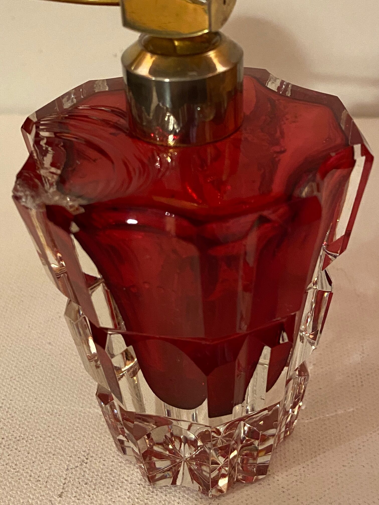 Red crystal perfume spray and red pump.