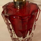 Red crystal perfume spray and red pump.