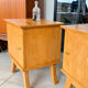 Vintage bedside table with tapered legs