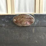 Trunk, black wooden chest and wallpaper