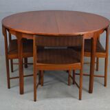 Round teak dinning table and chairs by Mctintosh