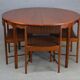 Table rondes et chaises en teck par Mcintosh