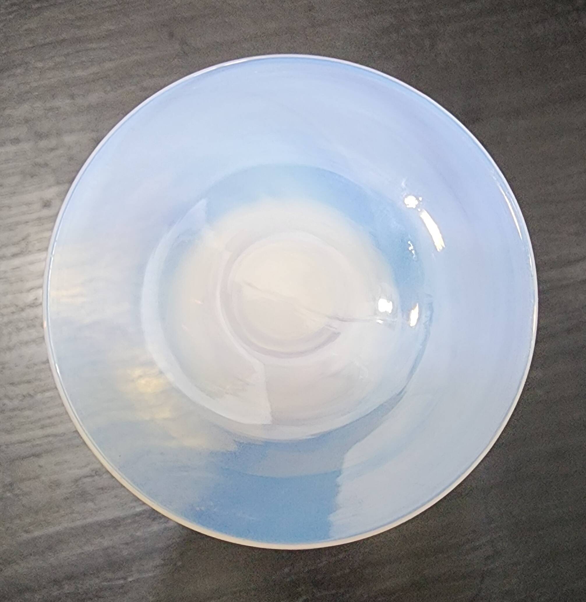 Vintage white opaline soliflore vase with blue reflections and twisted foot.