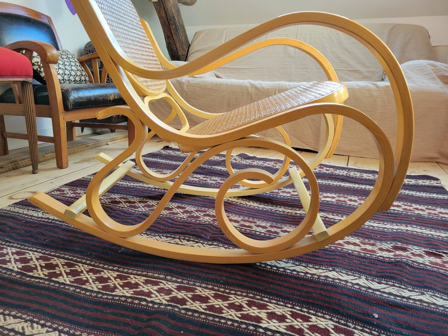 Rocking chair in arched wood and cane