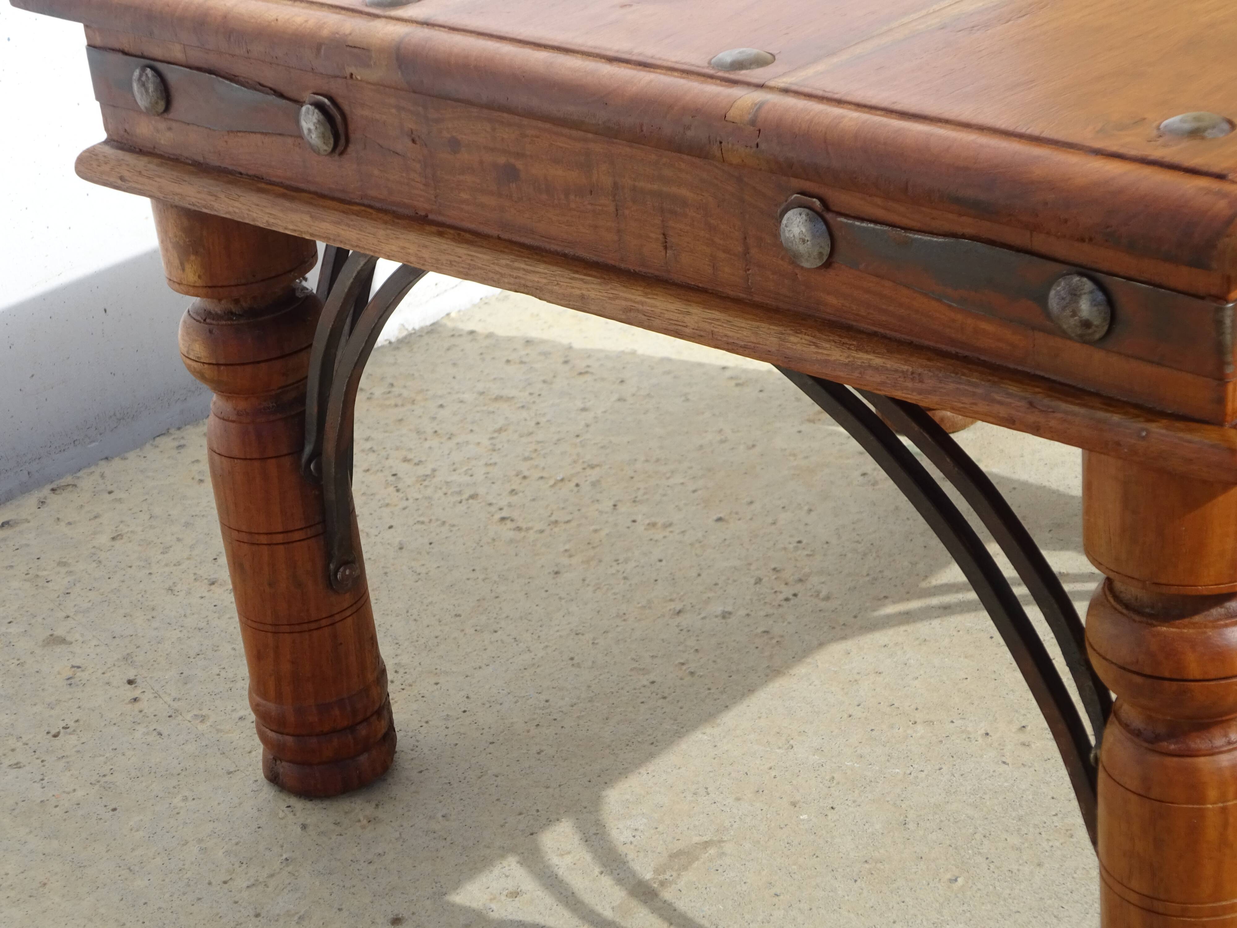 Square coffee table in exotic wood and wrought iron.